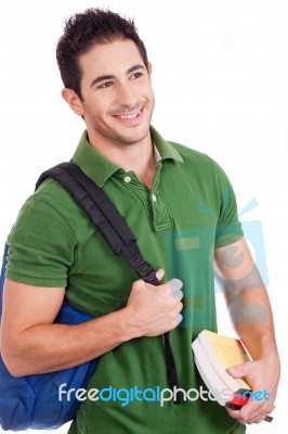 Student Carrying Bag And Books Stock Photo