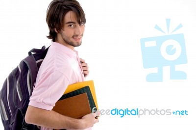 Student Holding Books And Bag Stock Photo