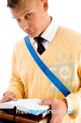 Student Holding Opened Notebook Stock Photo