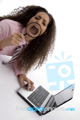 Student With Laptop And Magnifier Stock Photo