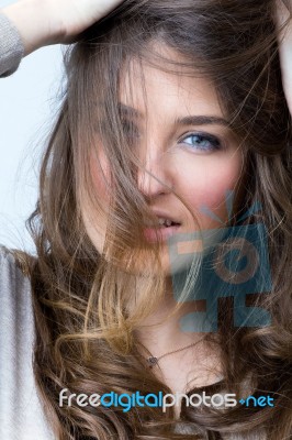 Studio Portrait Of Beautiful Young Woman Stock Photo