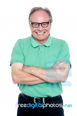 Studio Shot Of A Cheerful Elderly Man Stock Photo