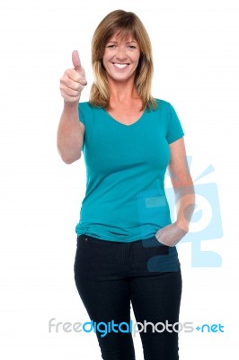 Stylish Blonde Woman Gesturing Thumbs Up Stock Photo