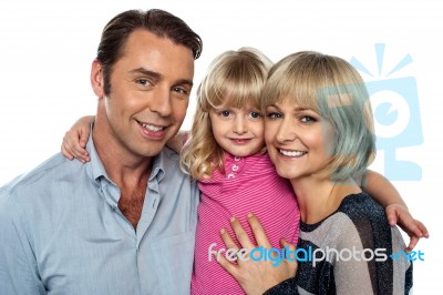 Stylish Little Daughter Embracing Her Parents Stock Photo