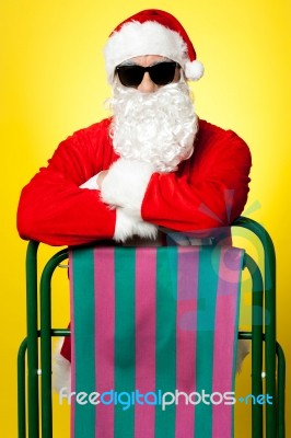 Stylish Male Santa Posing With A Deckchair Stock Photo