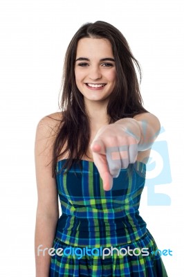 Stylish Teen Girl Indicating Forward Stock Photo