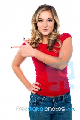 Stylish Teen Girl Pointing Away Stock Photo