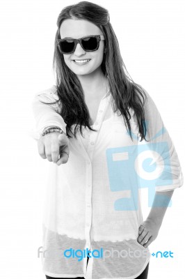 Stylish Teen Girl Wearing Goggles, Indicating Forward Stock Photo