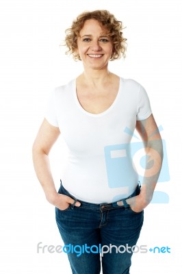 Stylish Woman Posing With Hands In Pocket Stock Photo