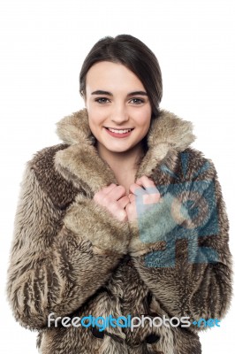 Stylish Young Girl In Fur Jacket Stock Photo