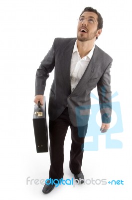 Successful Attorney Holding Office Bag And Looking Upwards Stock Photo