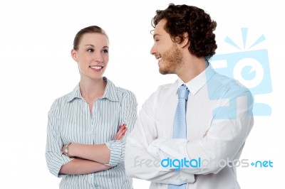 Successful Business Couple With Arms Crossed Stock Photo