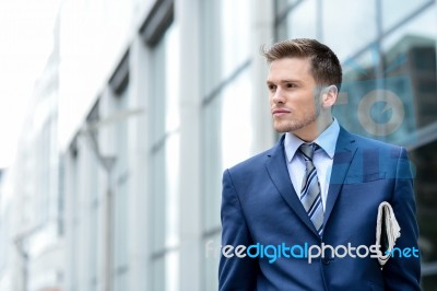 Successful Businessman Holding Newspaper Stock Photo