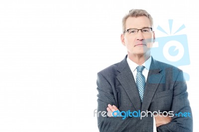 Successful Businessman With Folded Arms Stock Photo