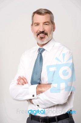 Successful Businessman With Folded Arms Stock Photo