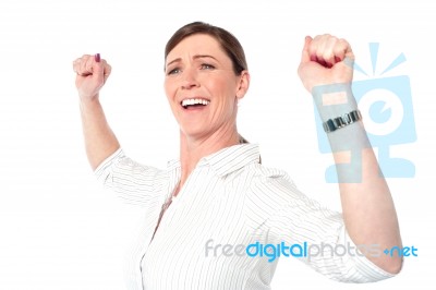 Successful Businesswoman With Clenched Fists Stock Photo