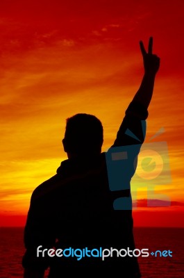 Successful Silhouette Man At Sunset Stock Photo