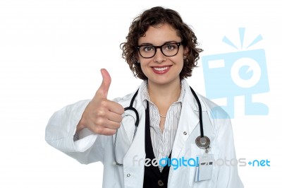 Successful Young Doctor Showing Thumbs Up Stock Photo