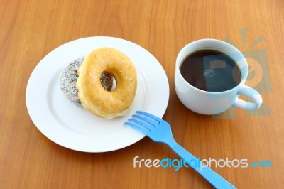 Sugar And Chocolate Donut On Breaking Time Stock Photo