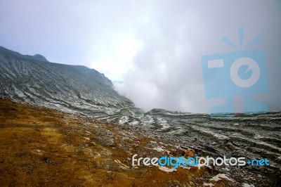 Sulfur Fumes From The Crater Of Kawah Ijen Volcano In Indonesia Stock Photo