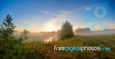 Summer Misty Sunrise On The River. Foggy River In The Morning. P… Stock Photo