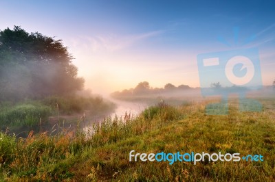 Summer Misty Sunrise On The River. Foggy River In The Morning. S… Stock Photo