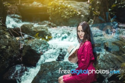 Summer Portrait Of Young  Women Enjoying Nature  In Tight Fitting Red Dress Summer Vacation,sunny,having Fun, Positive Mood,romantic, Against Background Of Summer Green Park, Green Leaves Stay Outdoor Stock Photo