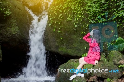 Summer Portrait Of Young  Women Enjoying Nature  In Tight Fitting Red Dress Summer Vacation,sunny,having Fun, Positive Mood,romantic, Against Background Of Summer Green Park, Green Leaves Stay Outdoor Stock Photo