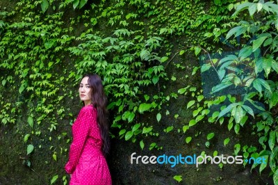 Summer Portrait Of Young  Women Enjoying Nature  In Tight Fitting Red Dress Summer Vacation,sunny,having Fun, Positive Mood,romantic, Against Background Of Summer Green Park, Green Leaves Stay Outdoor Stock Photo