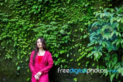 Summer Portrait Of Young  Women Enjoying Nature  In Tight Fitting Red Dress Summer Vacation,sunny,having Fun, Positive Mood,romantic, Against Background Of Summer Green Park, Green Leaves Stay Outdoor Stock Photo