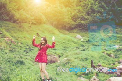 Summer Portrait Of Young  Women Enjoying Nature  In Tight Fitting Red Dress Summer Vacation,sunny,having Fun, Positive Mood,romantic, Against Background Of Summer Green Park, Green Leaves Stay Outdoor Stock Photo