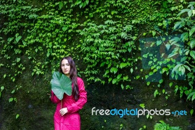 Summer Portrait Of Young  Women Enjoying Nature  In Tight Fitting Red Dress Summer Vacation,sunny,having Fun, Positive Mood,romantic, Against Background Of Summer Green Park, Green Leaves Stay Outdoor Stock Photo