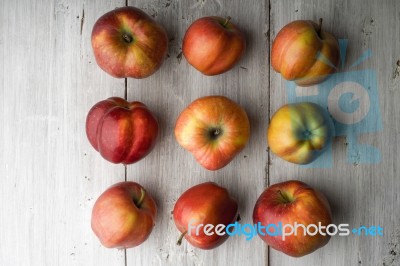 Summer Red Apples On White Boards Stock Photo