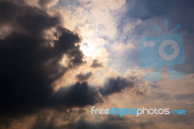 Sun Behind Clouds Background Stock Photo