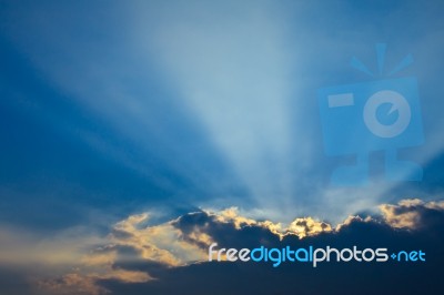 Sun Ray Behind Dark Cloud Stock Photo