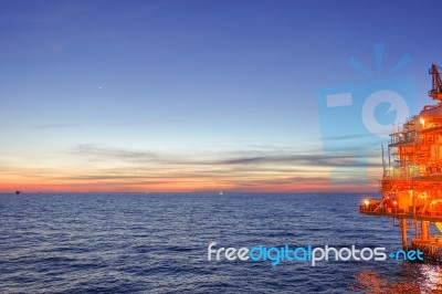 Sun Set At The Sea From Offshore Platform With Warm Light And Li… Stock Photo