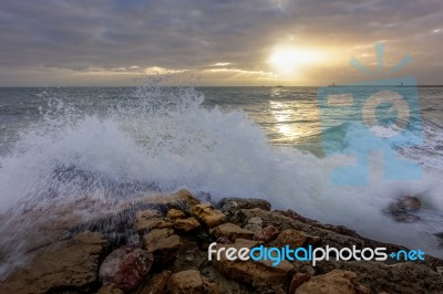 Sun Setting At Quarteira In Portugal Stock Photo