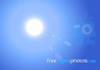 Sunburst On Blue Sky Background Stock Image