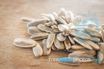 Sunflower Seeds On Weathered Wood Stock Photo