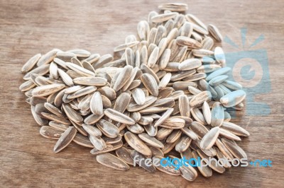 Sunflower Seeds On Weathered Wood Stock Photo