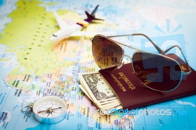 Sunglasses, Passport, Money, Compass And Aircraft On The World M… Stock Photo