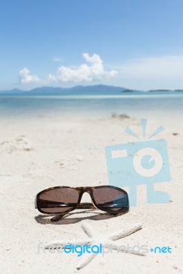 Sunglesses And Starfish On Sand Beach Stock Photo