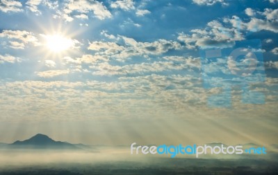 Sunlight Over Mountain Stock Photo