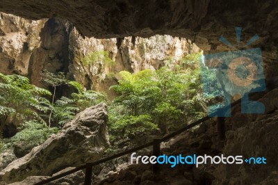 Sunlight Through A Cave Hole In Thailand Stock Photo