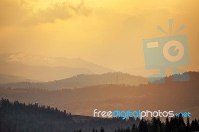 Sunny Spring Evening In Mountain Village. Fields And Hills Stock Photo