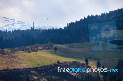 Sunny Spring In Mountain Village. Fields And Hills Stock Photo