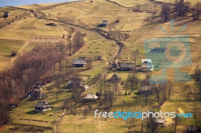 Sunny Spring In Mountain Village. Fields And Hills Stock Photo