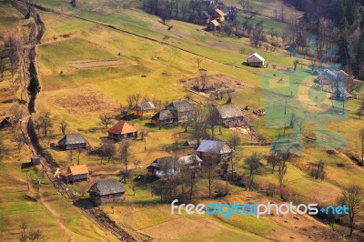 Sunny Spring In Mountain Village. Fields And Hills Stock Photo