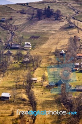 Sunny Spring In Mountain Village. Fields And Hills Stock Photo