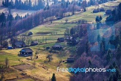 Sunny Spring In Mountain Village. Fields And Hills Stock Photo